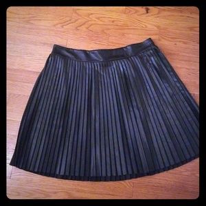 FALL TREND: Black faux leather pleated skirt